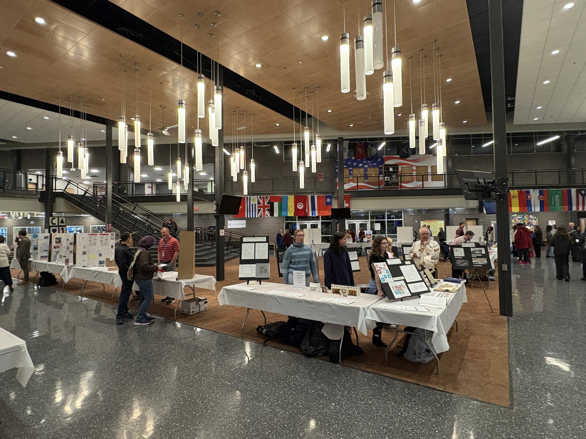 Teachers and students set up displays in the HUB to present to attendees.