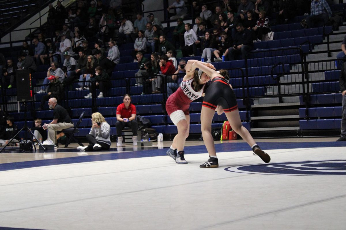 Sophomore Isabelle Dubler and her opponent locked together during their match.