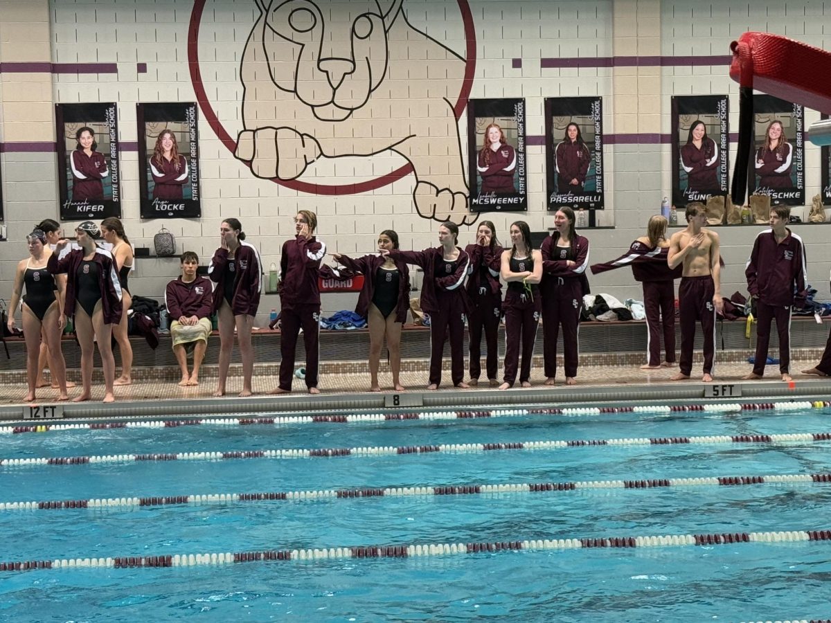 The State High Swim Team competed against Central Dauphin on Jan. 9. The team gathered along the pool's edge to support their teammates' swimming. The team has a strong bond of teamwork, which is shown through team spirit and perseverance. “I think everybody is very supportive, and the cheering at home meets is uplifting and makes people happier,” freshman Natalie Huggins said. 