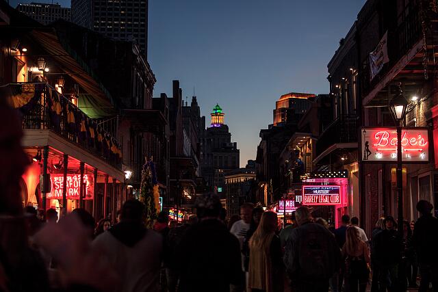 Bourbon Street, a historic street famous for its bars and clubs, is crowded with people. Retrieved from the Library of Congress. Courtesy of Carol M. Highsmith. 
