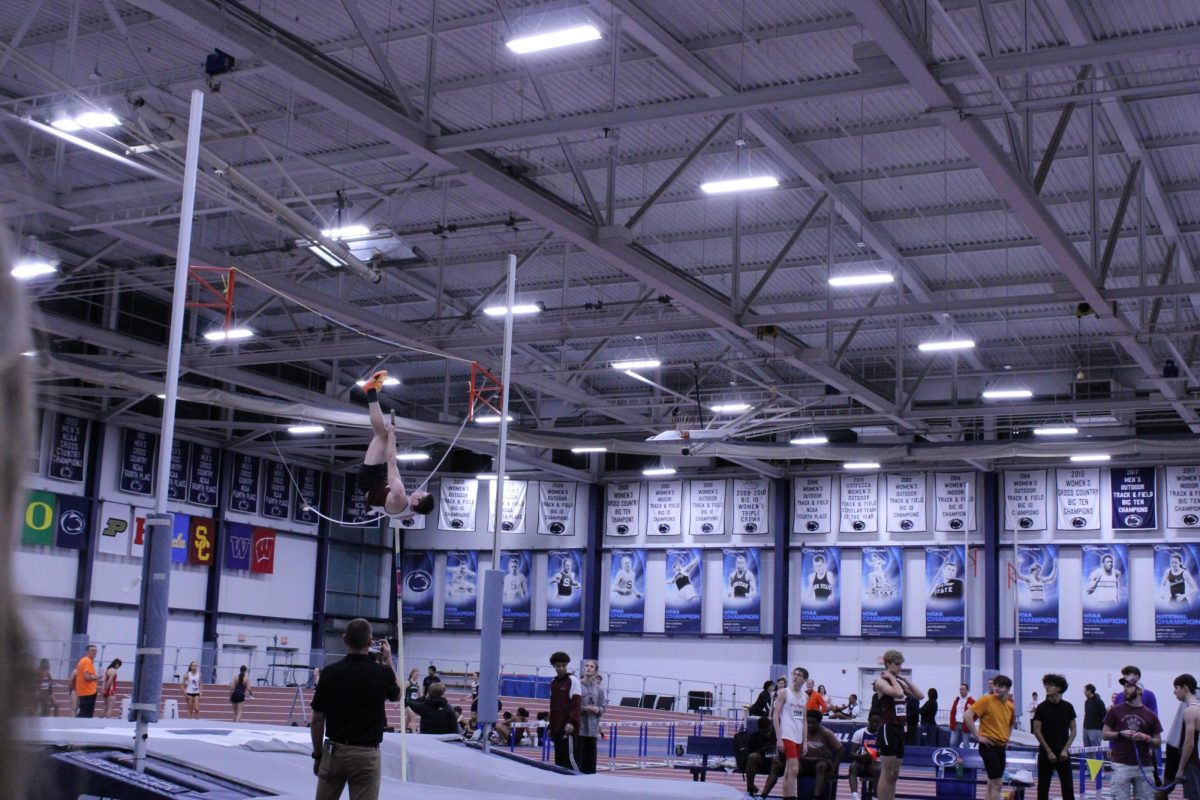 Adam Bell warms up for the Boy's Pole Vault event at the meet.