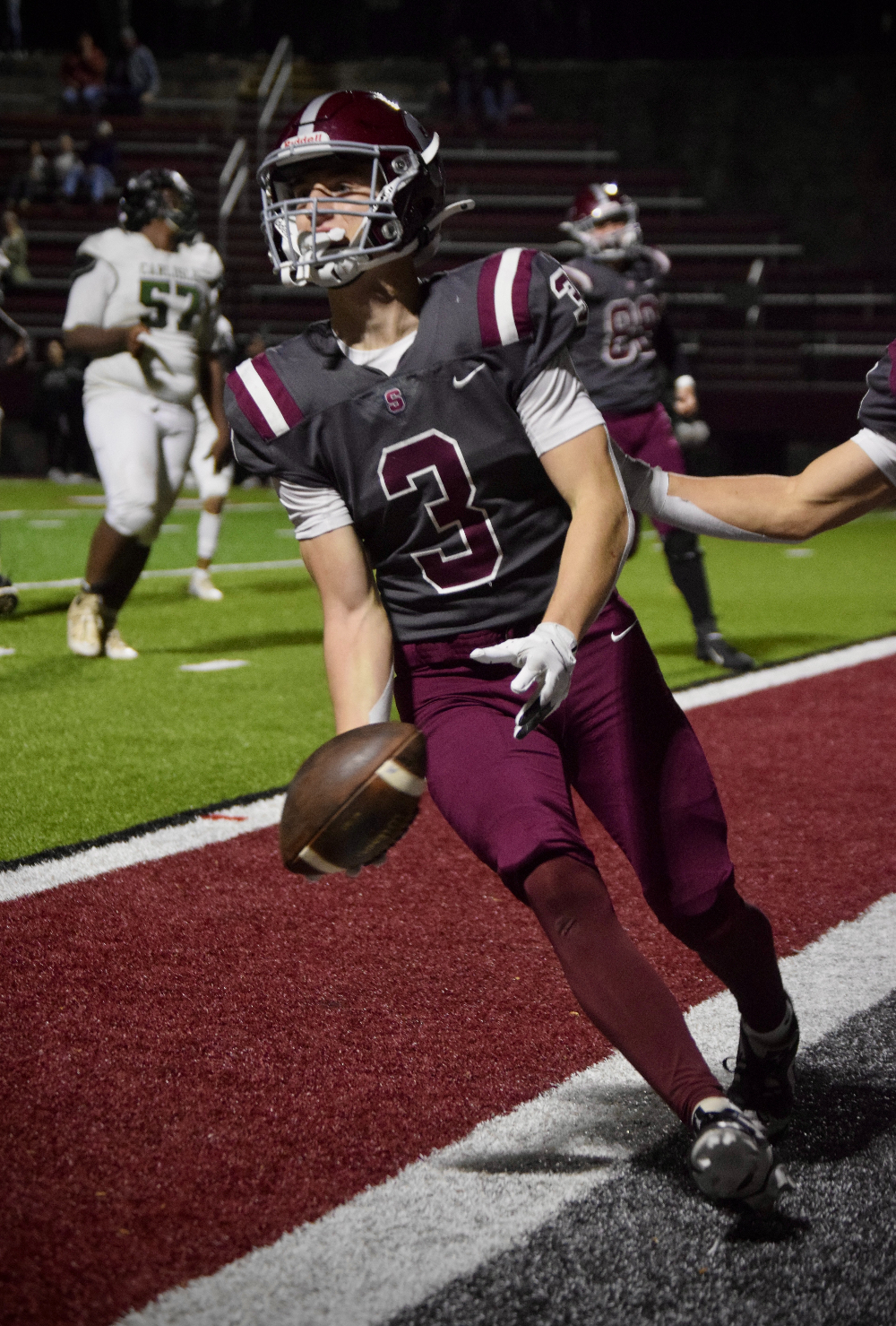 Senior Ty Salazer tosses the ball to the referee after scoring a touchdown against Carlisle. 