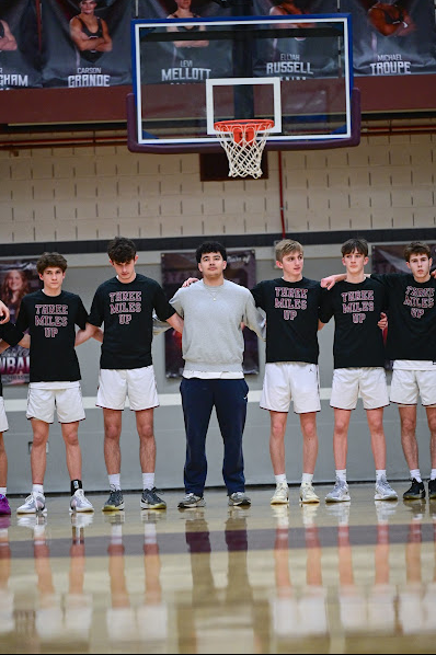 The State High Boys Basketball team stands for the national anthem prior to their PIAA subregional game vs. Erie McDowell.