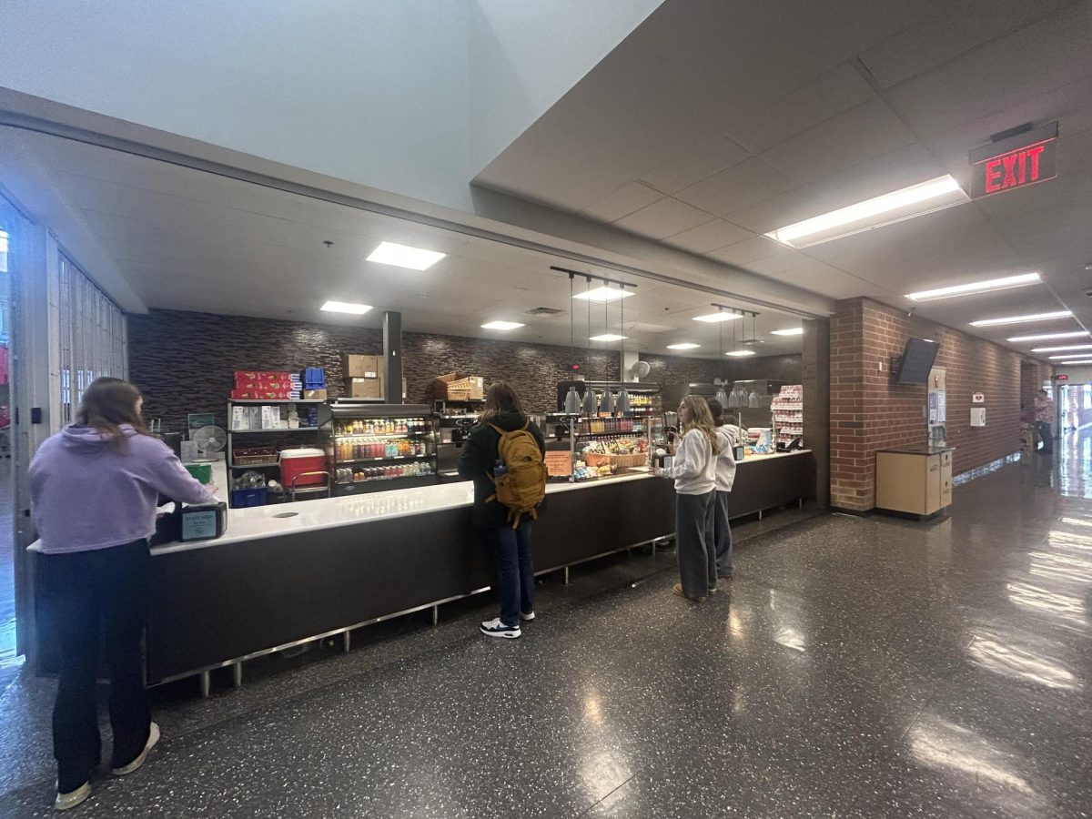 Students are lined up at the snack bar waiting to purchase something to grab a quick bite before their next class.