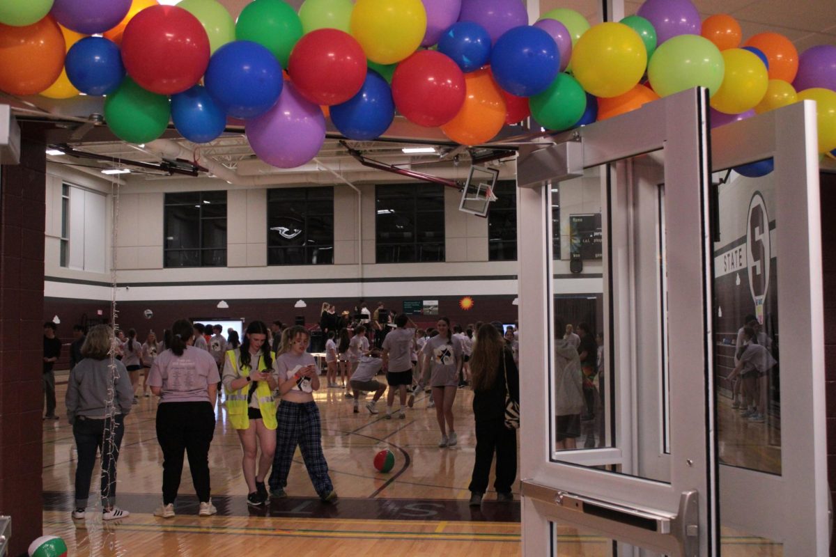Colorful balloon entrance leading into the gym. 