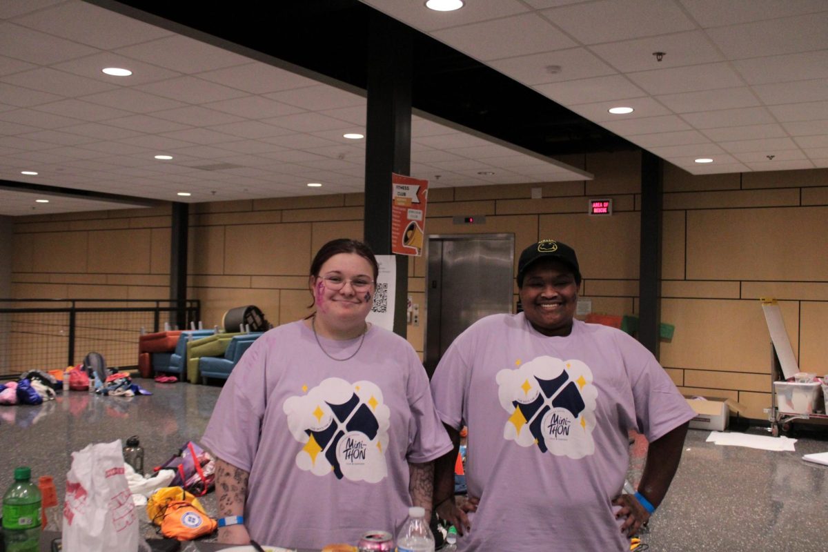 Two Culinary students, Leo Wirth (left) senior and Max Carr (right) sophomore, supervising the free concession table. “In that hot box over there, is about 7 other containers full of mac and cheese" Wirth stated. “We also have snacks down here for people if their blood sugar gets low or anything” Carr said. 

