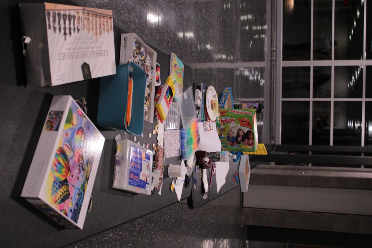 Table full of board games outside the gymnasium used to keep students up and entertained during the remaining time. 
