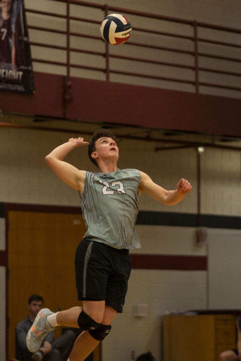 Sophomore Ty Miller delivers a serve to the other team.