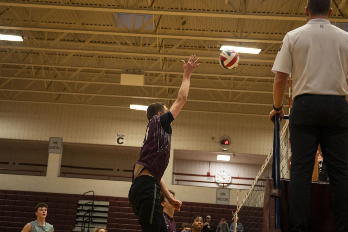Spike from senior Carter Weight brings the team up 21-20 in the last set.