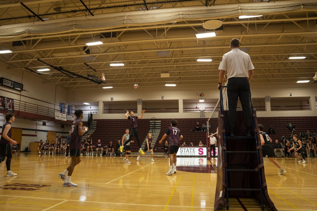 Senior Carter Weight spikes the ball to the opposing team.