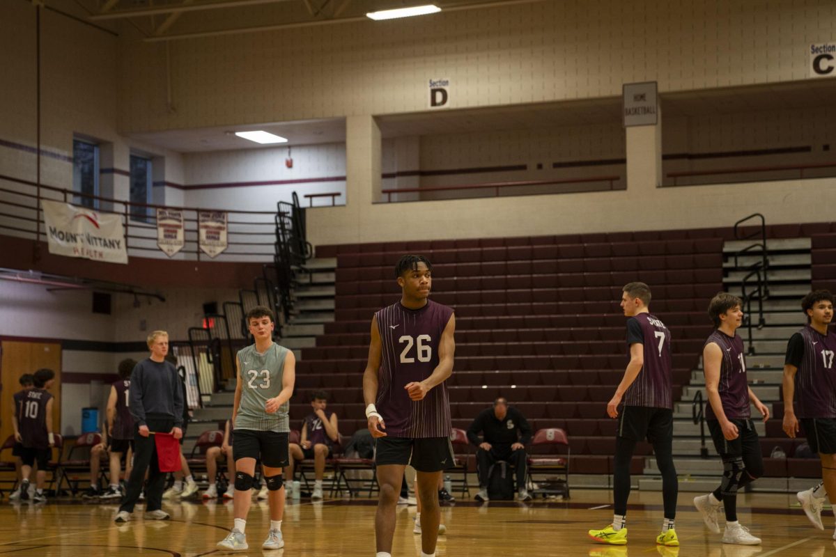 State High team members look defeated after a lost point.