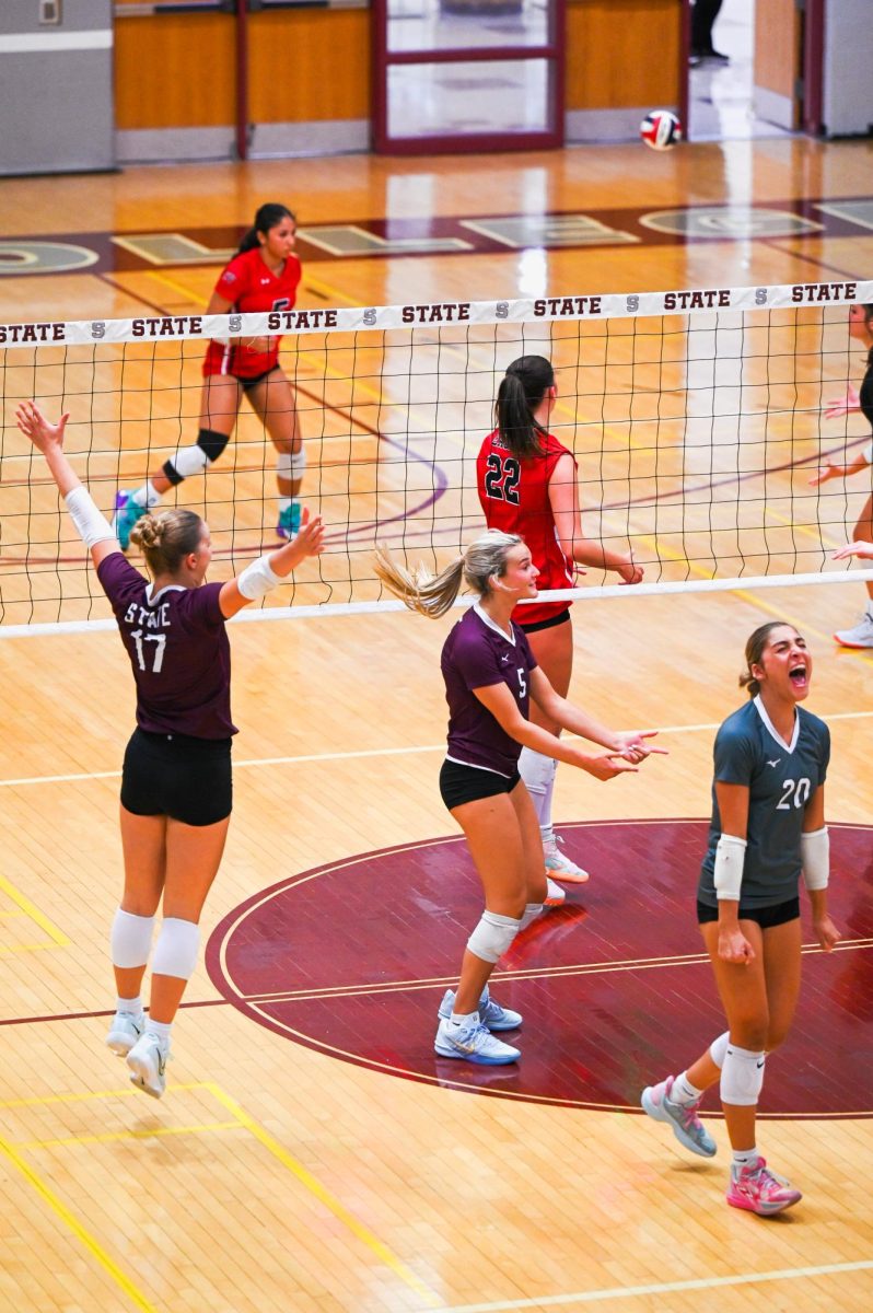 Senior Harper Campbell celebrates with her team after winning a pivotal point. Just as CV was making a late push in the third set, Campbell stopped the run with a powerful kill. “My favorite part about our team is how close we are on and off the volleyball court and the team’s chemistry,” Campbell said. 