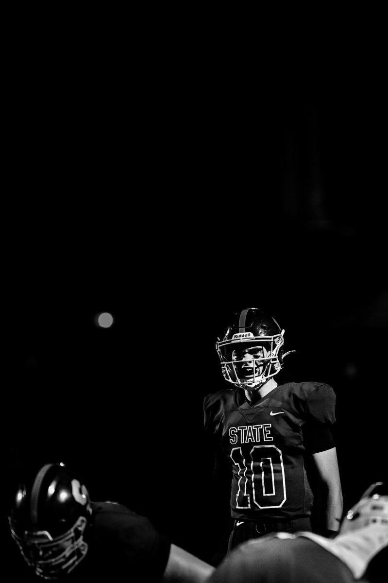 Sophomore Connor Kulka calls an audible before receiving a redzone snap against Cumberland Valley. Kulka, who started the year as the second string quarterback, has rose to the occasion as a starter, helping lead his team to four wins on the season so far. "It's been great going into every game knowing that if we play together, we can win every game. As I stepped into a new situation all my teammates supported me, giving me the confidence to make plays and get the ball to playmakers," Kulka said. 