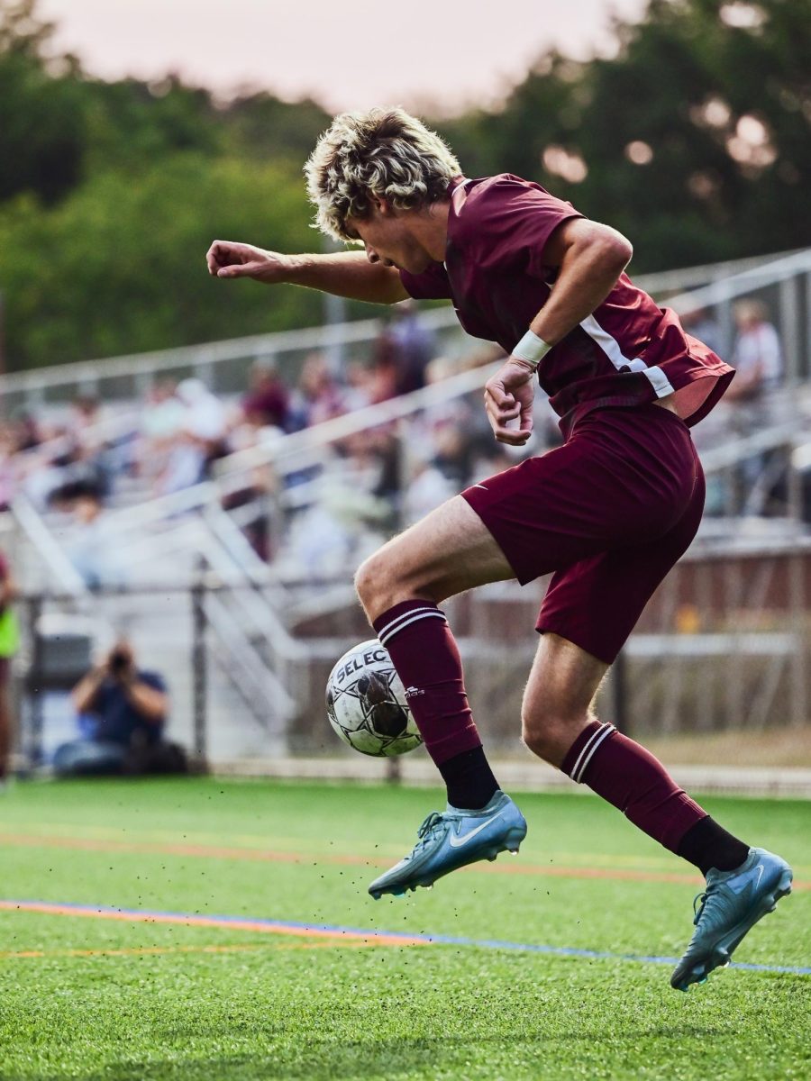 Senior James Sheehan juggles a ball after receiving a cross field pass.