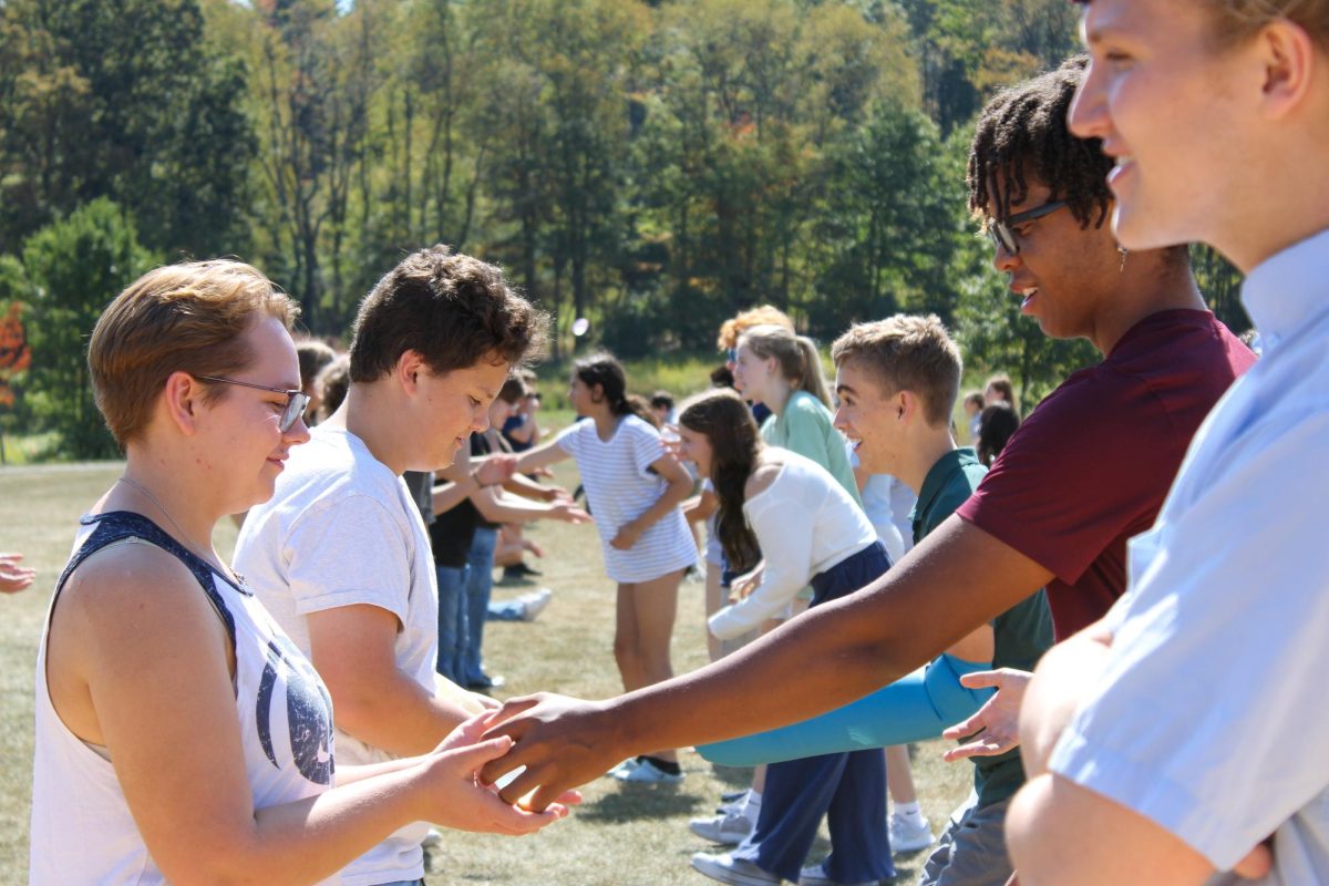 State High Choir members engage in a game of water balloon toss, getting excited for the year of singing and community building.