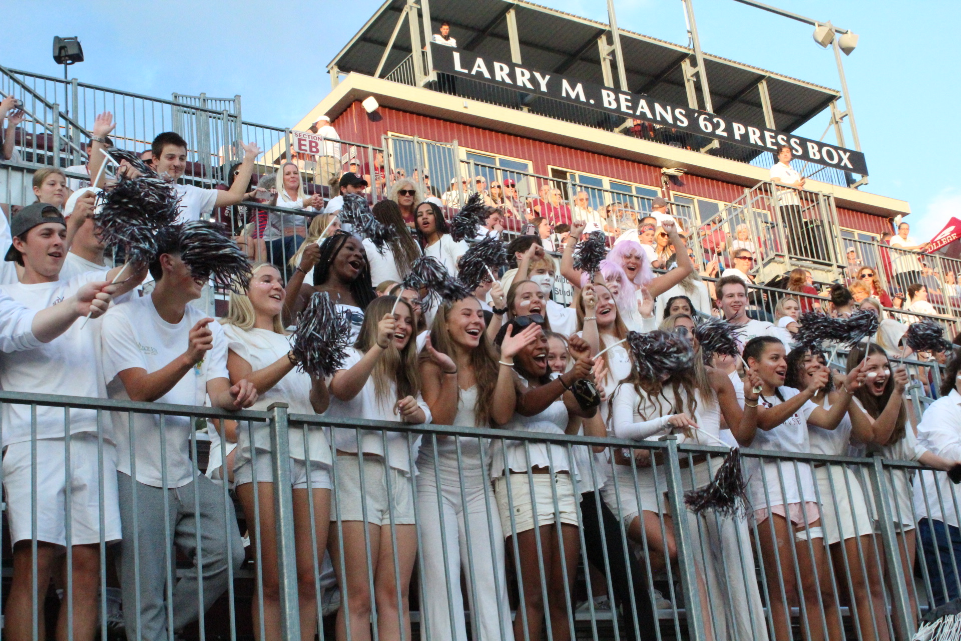 State High fans cheer on the Little Lions cheerleaders as they perform their pre-game routine
