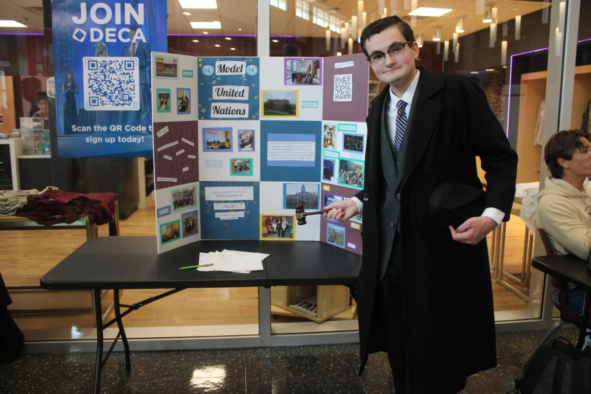 Member of Model United Nations explains to students how joint Model UN can help them improve their public speaking skills, which will help in life.