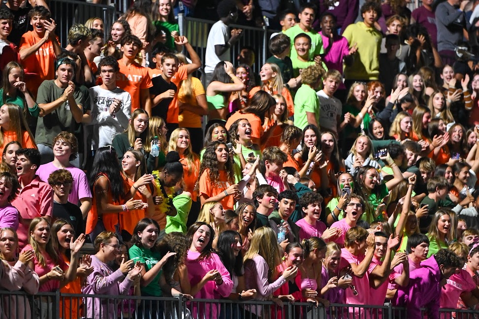 The student section cheers at the "Color Wars" football game on September 5