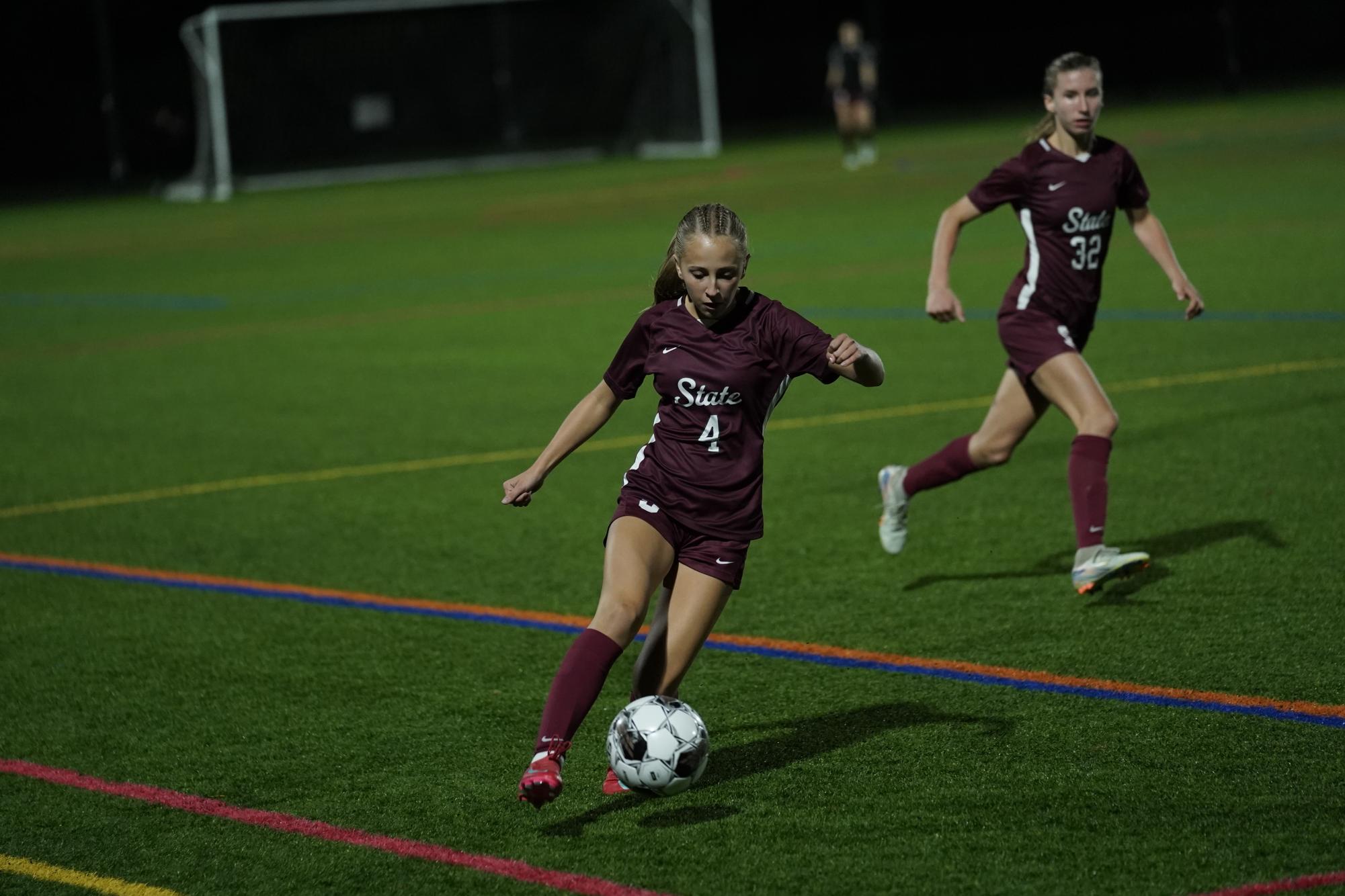 Freshman Taylor Langer saves the ball from going out of bounds in a game on Oct. 14.