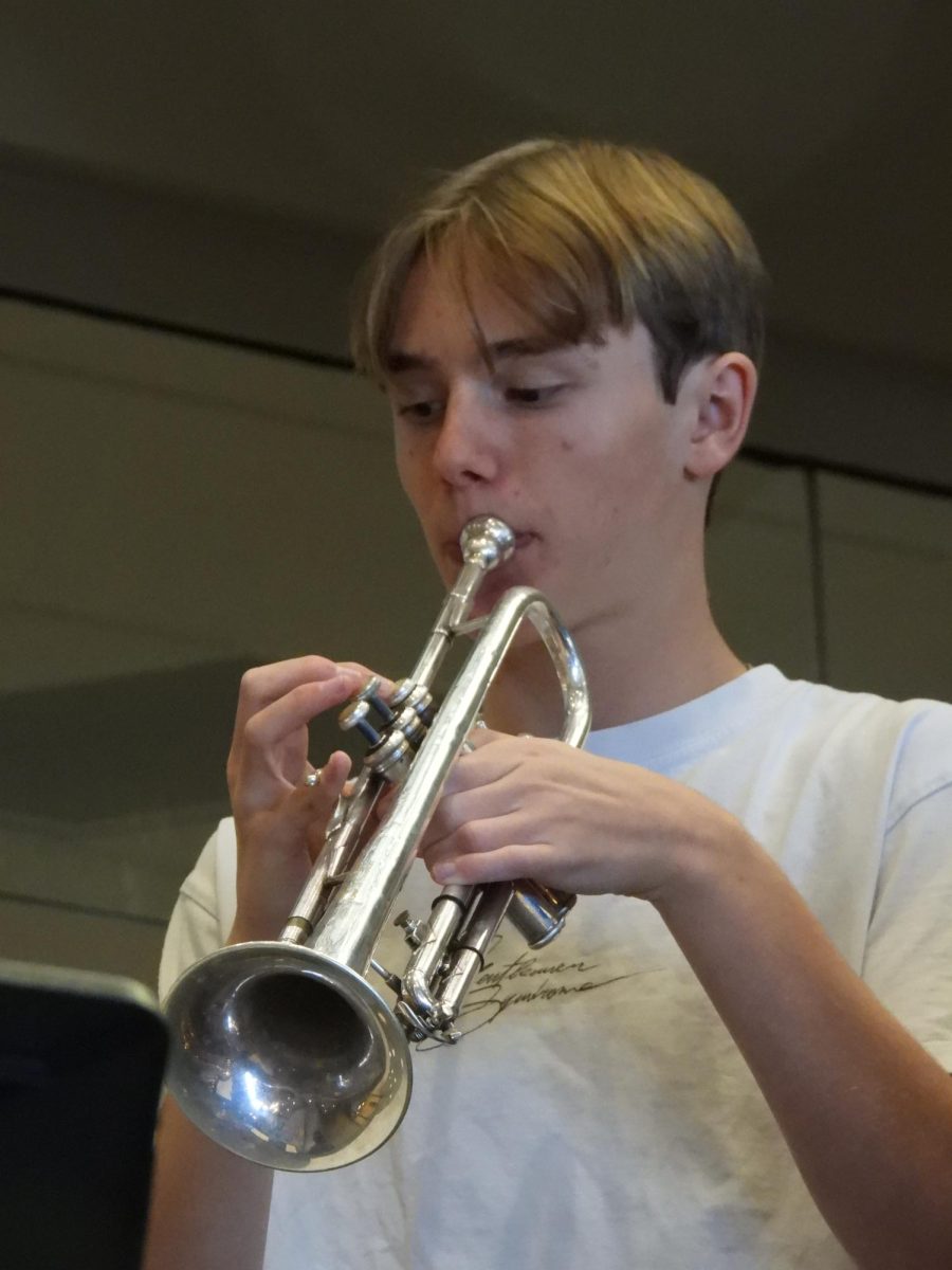 Senior David Kline plays trumpet with the Smash Tacklers.