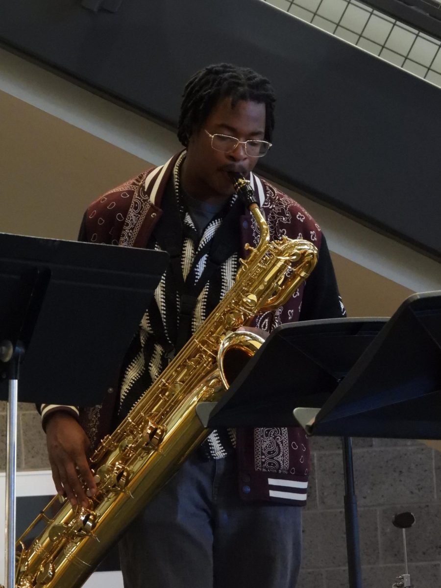 Senior Abraham Abdul-Hamid plays bass saxophone with the Smash Tacklers.