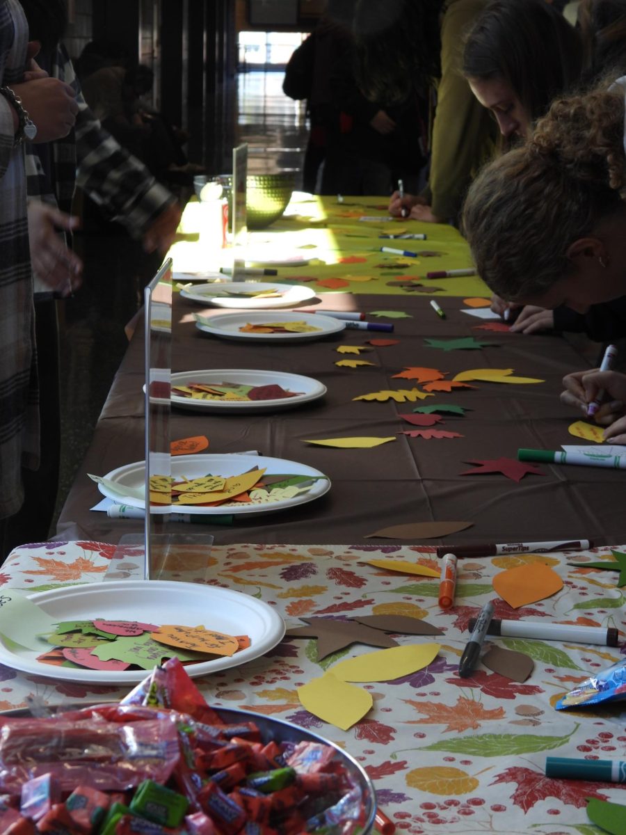 The Mental Health Matters Club table sits in the hub covered with fall decor.