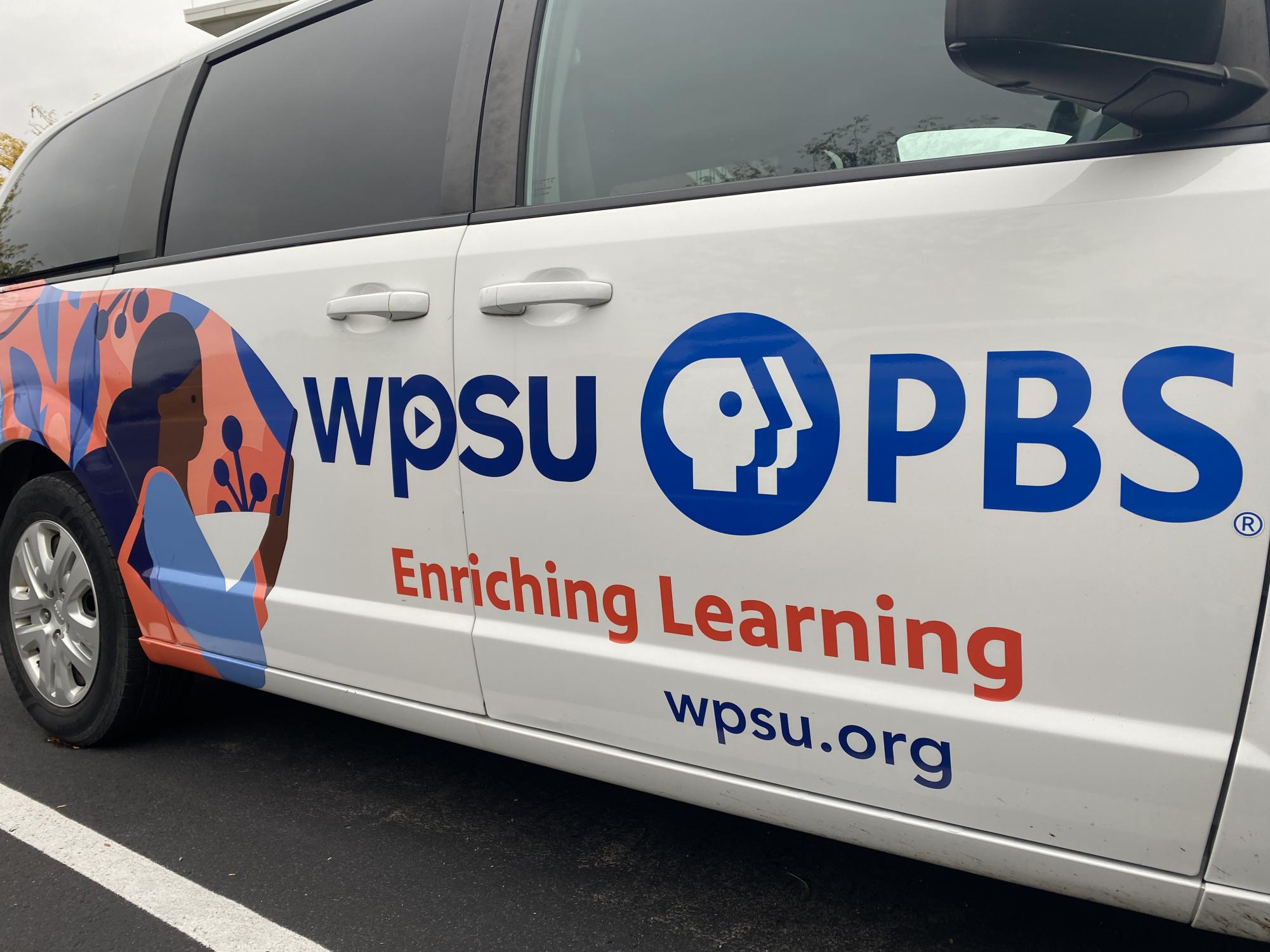 A WPSU van stands outside its Innovation Park offices.