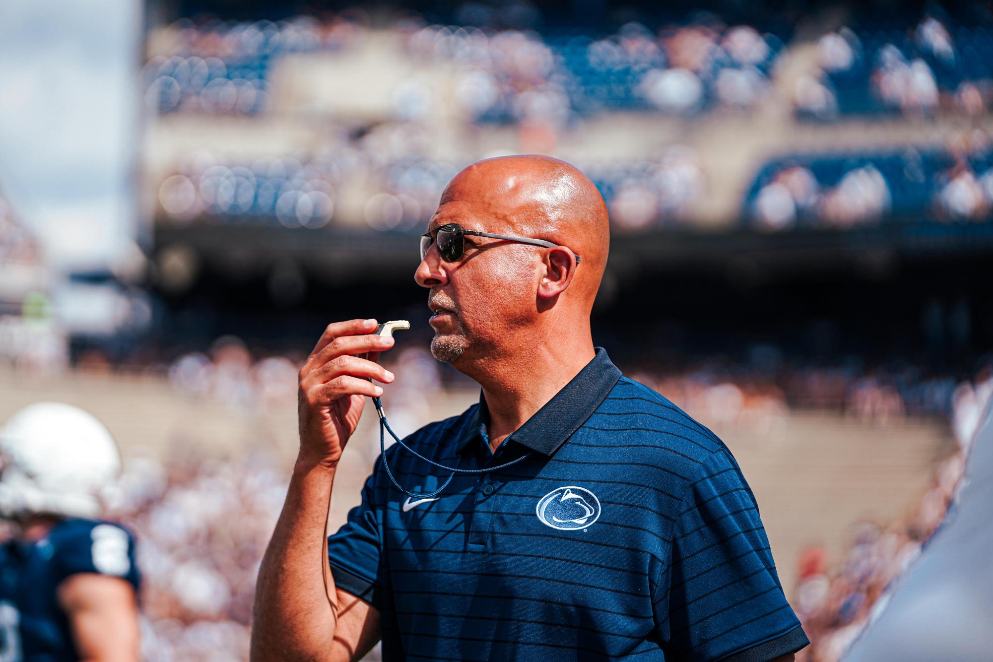 Former Penn State head coach James Franklin ready to blow his whistle during pregame drills.