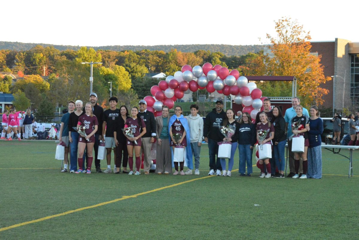 Girls soccer seniors stand together