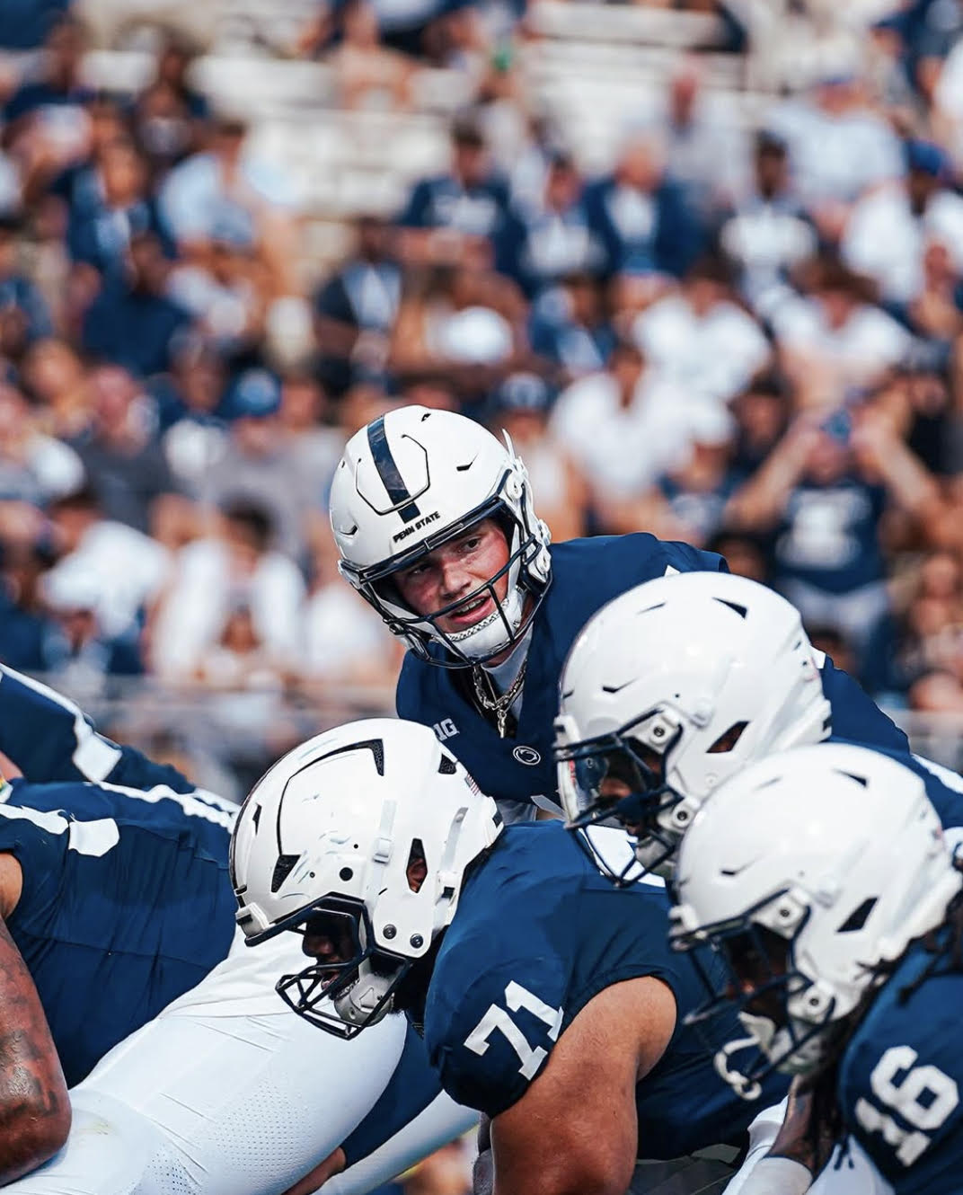 Penn State quarterback Drew Allar communicates with his offensive line before the play begins.