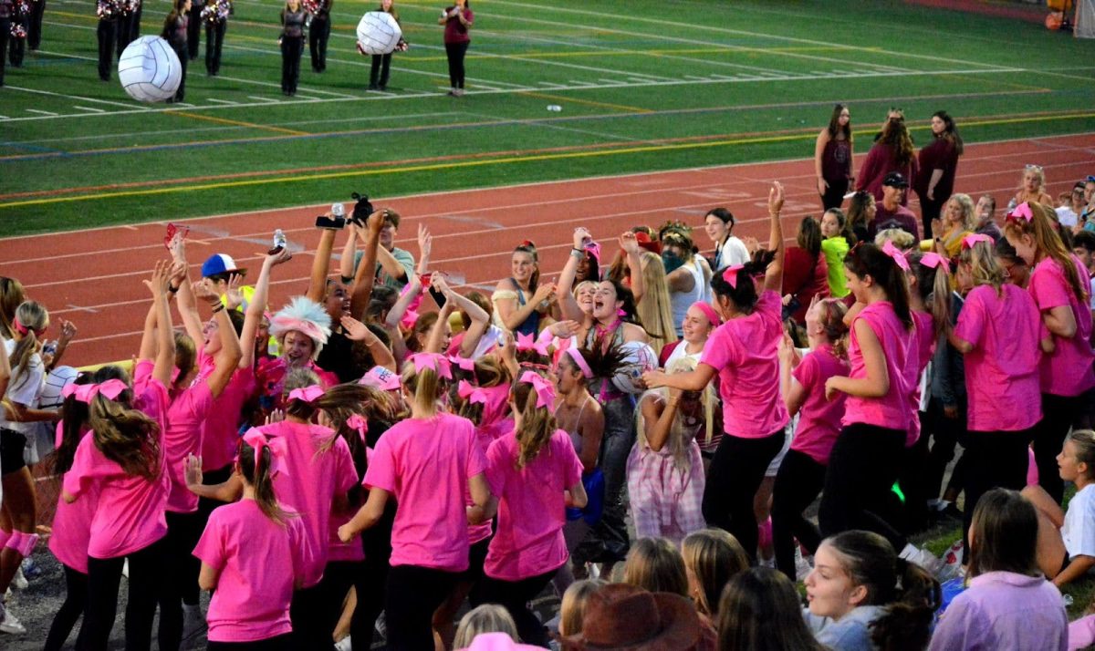 The girls' volleyball team celebrates after being crowned the winners of the annual best float competition. Announced at the pep rally at the south track, the field hockey team placed second, and the building construction team came in third. This feeling is nothing new for the volleyball team, as they have had a history of success in the competition.
