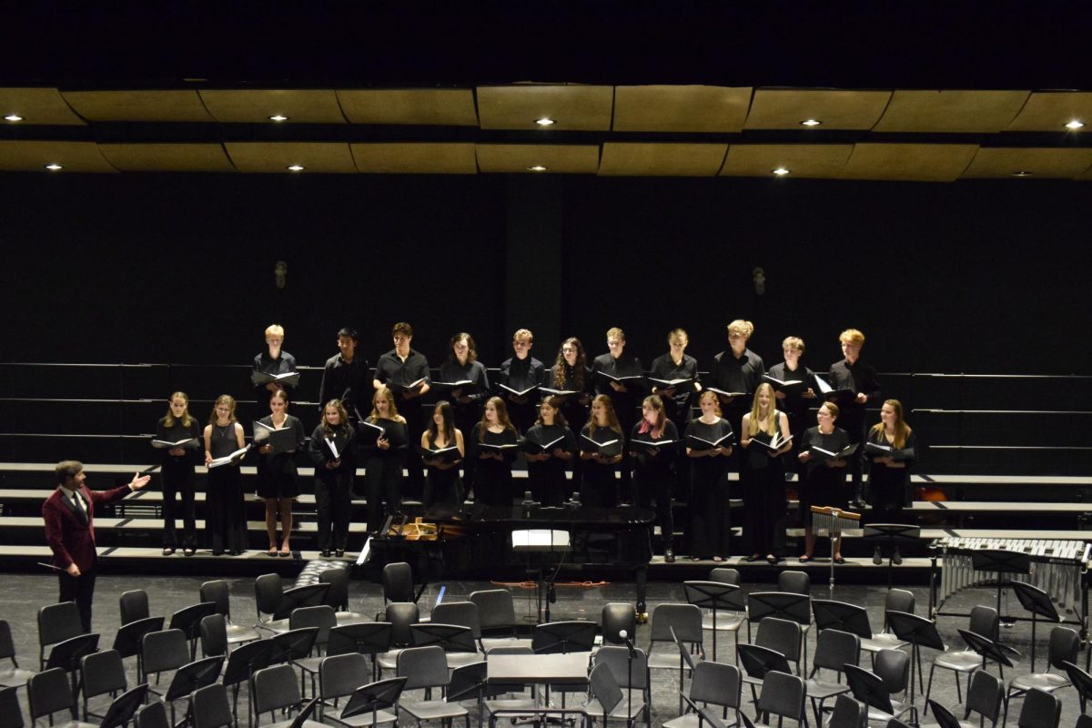 Chamber Singers concludes their set at the performance, directed by Erik Clayton.