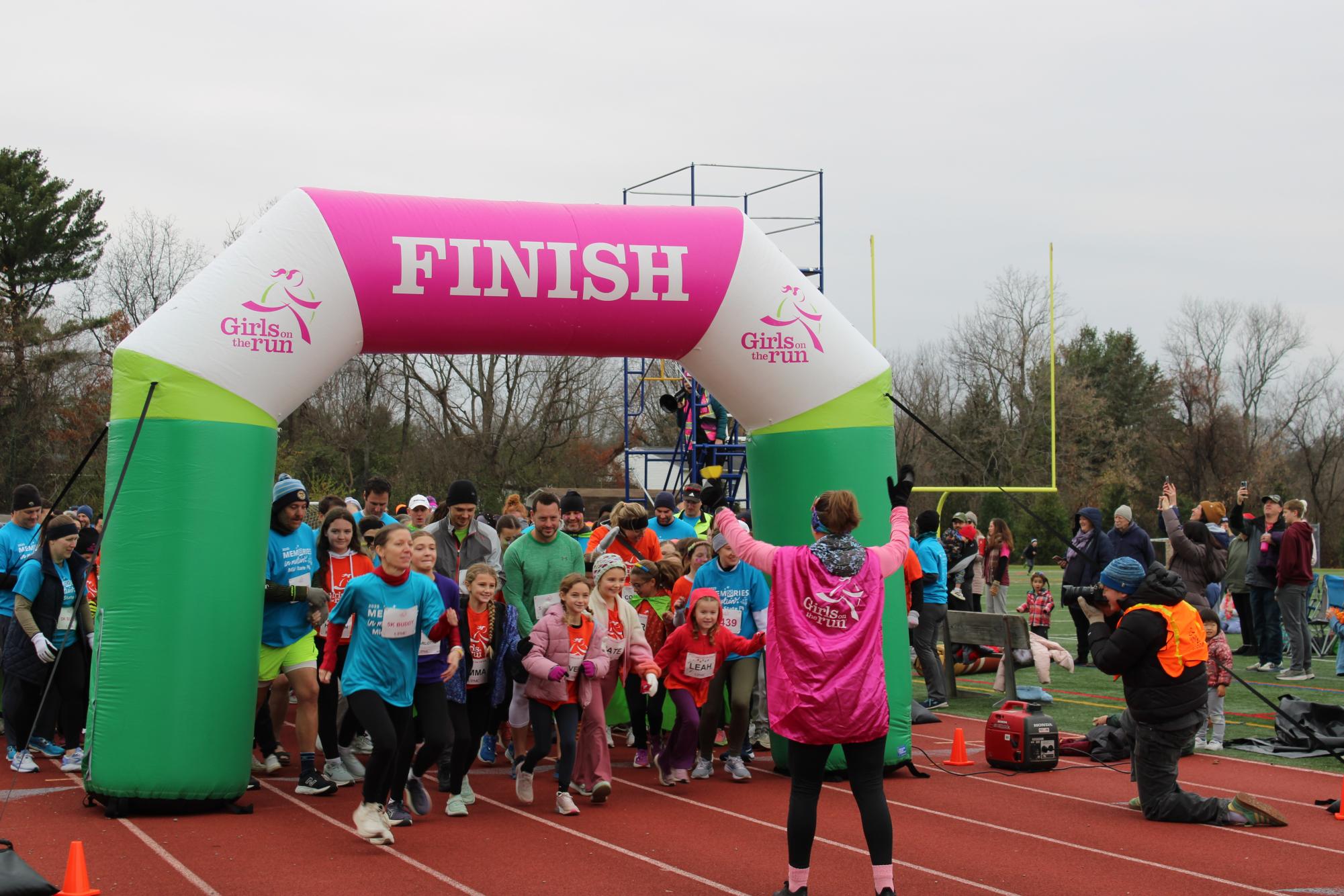 Runners gather at the starting line at the South Track for Girls on the Run Fall 5k