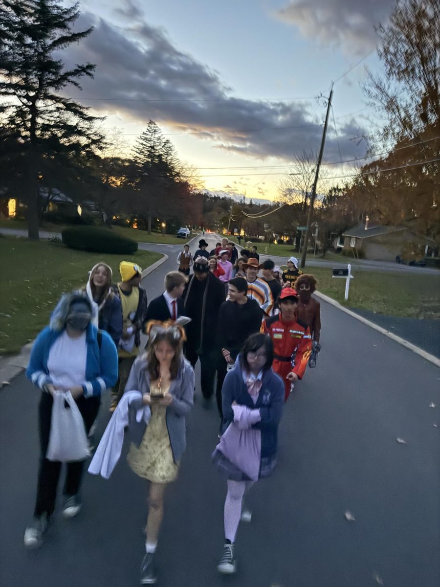 Group of teenagers out trick-or-treating for fun