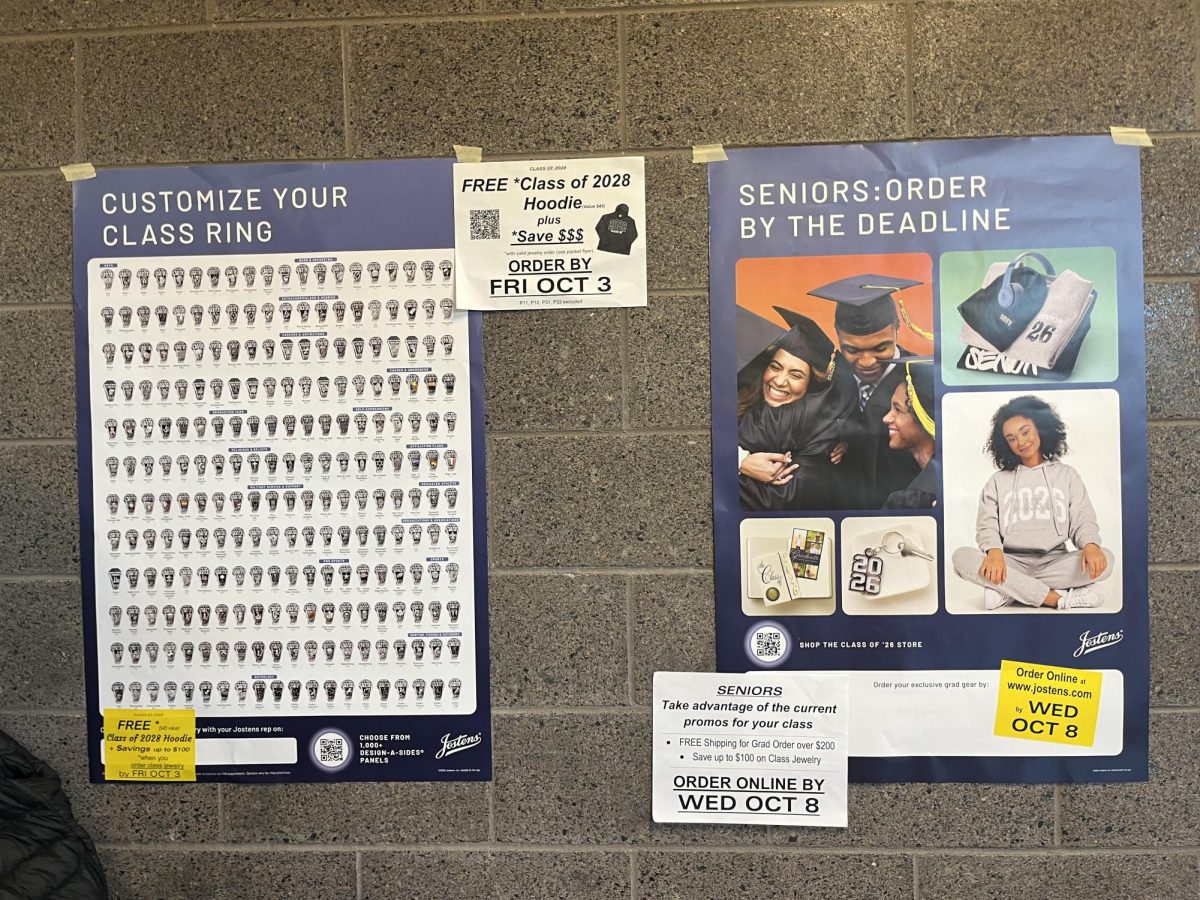 Two posters in the SCAHS hub showcase Jostens' products, surrounded by smaller papers that say to 'order now!'