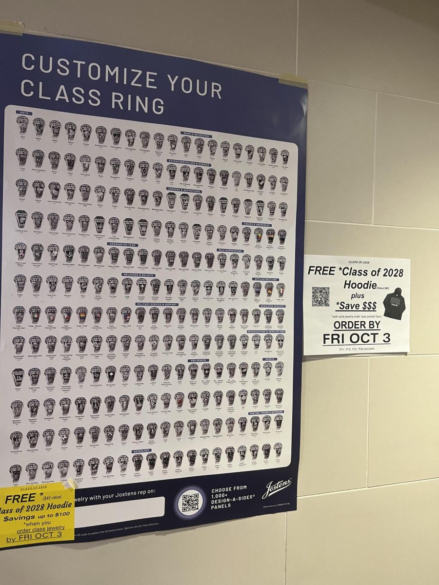 A Jostens poster advertisement in the SCAHS cafeteria promoting rings and hoodies.