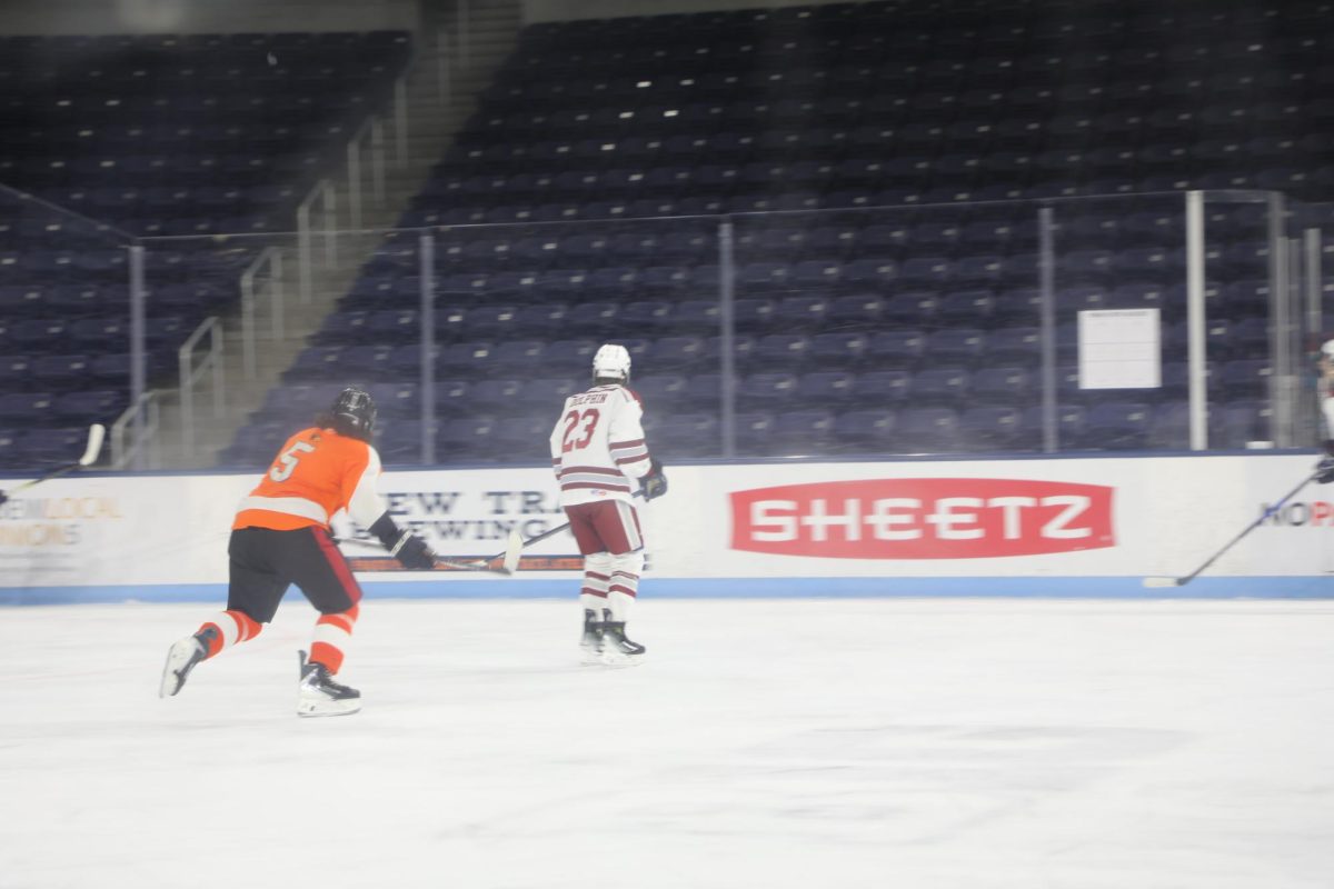 Ryan Dolphin hangs back, defending the middle from a pass.