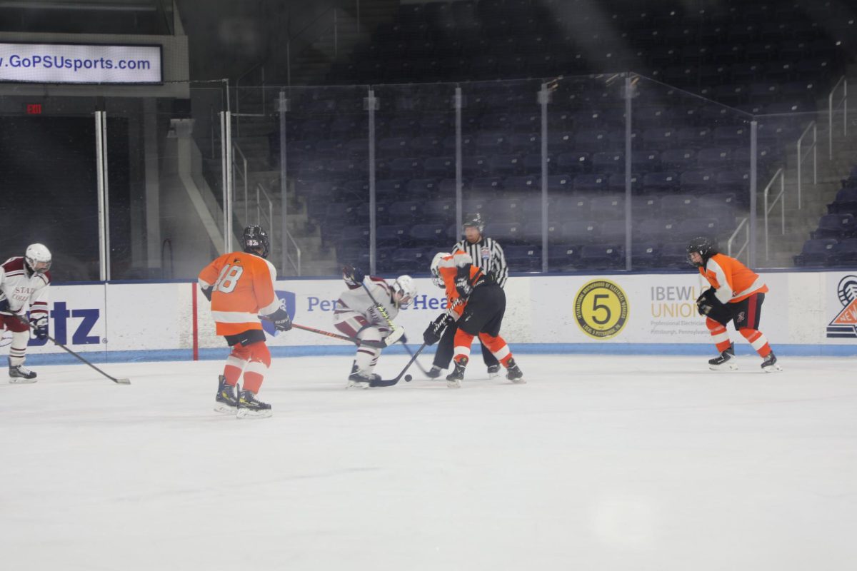 A fight for the puck after a tip off.