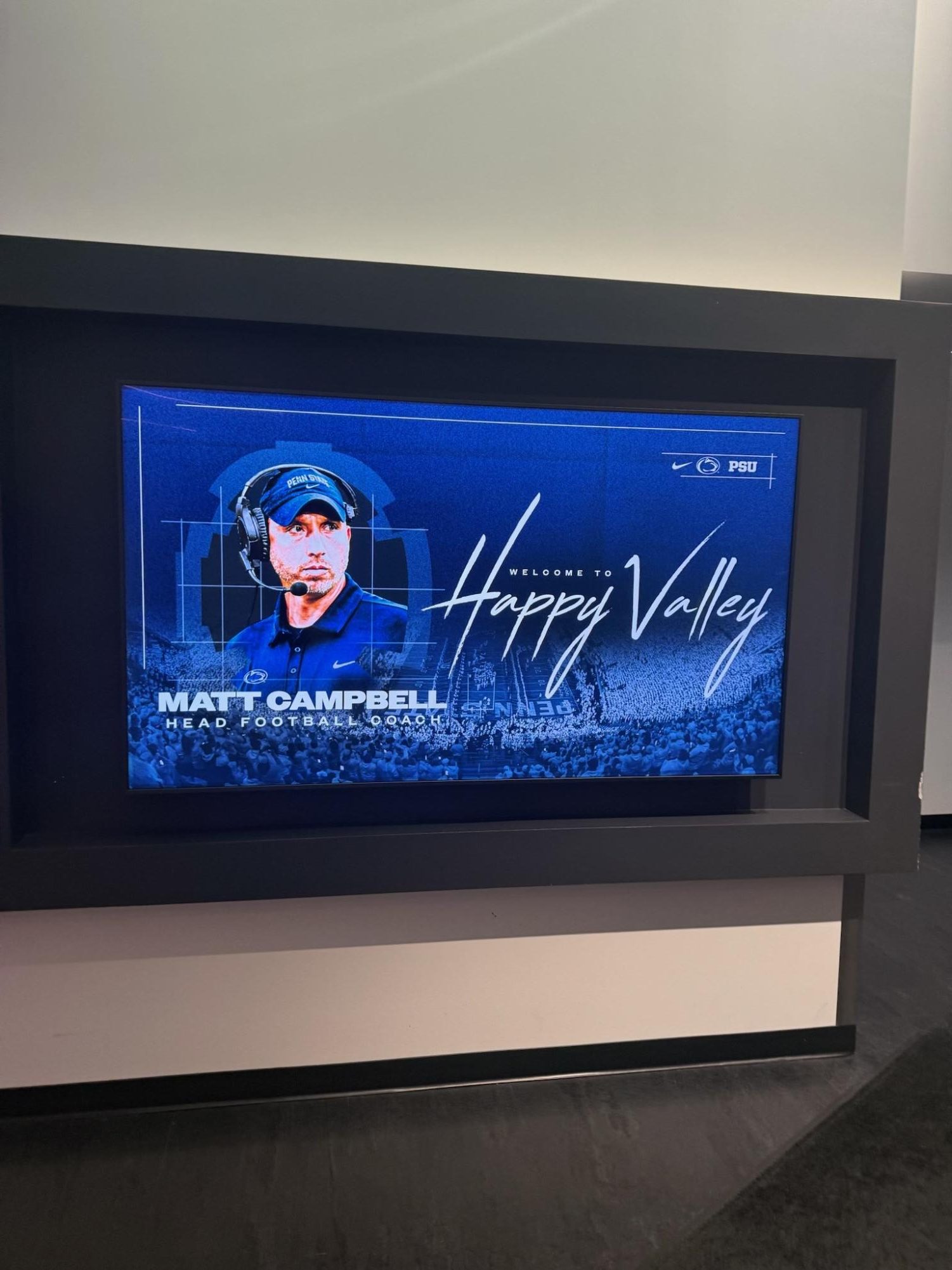 Television displays a graphic welcoming Coach Matt Campbell to Happy Valley. Photo Courtesy of Joel Kramer.