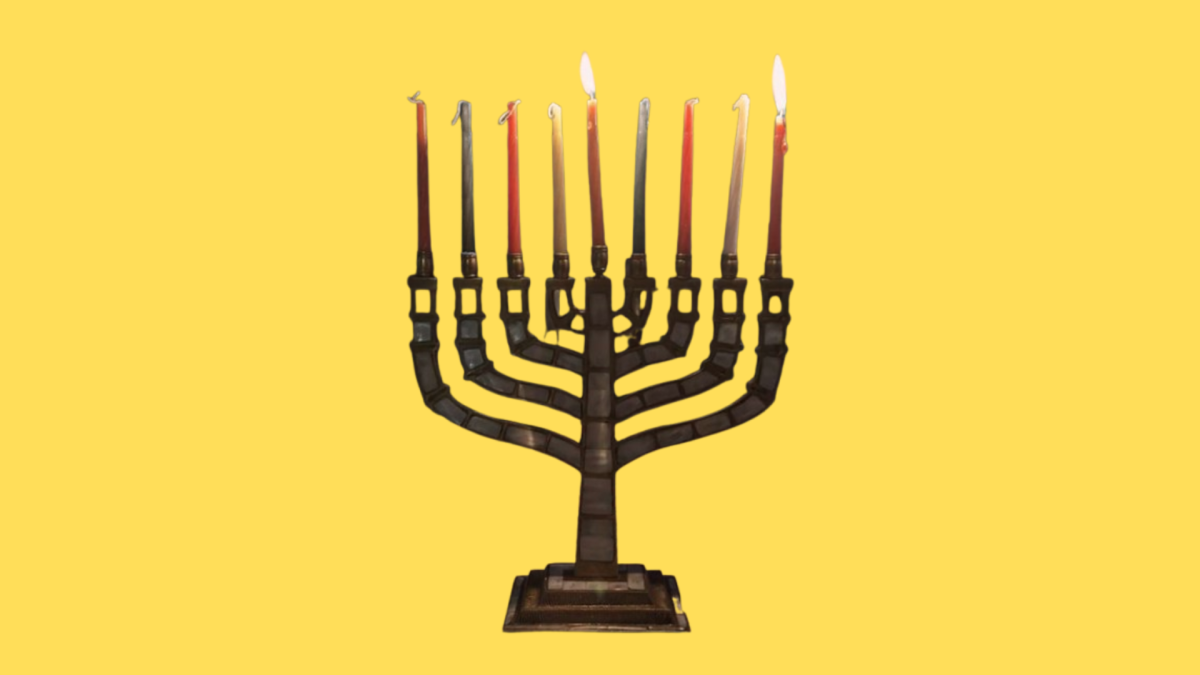 Photo of a menorah with a yellow background courtesy of Ella Beck.