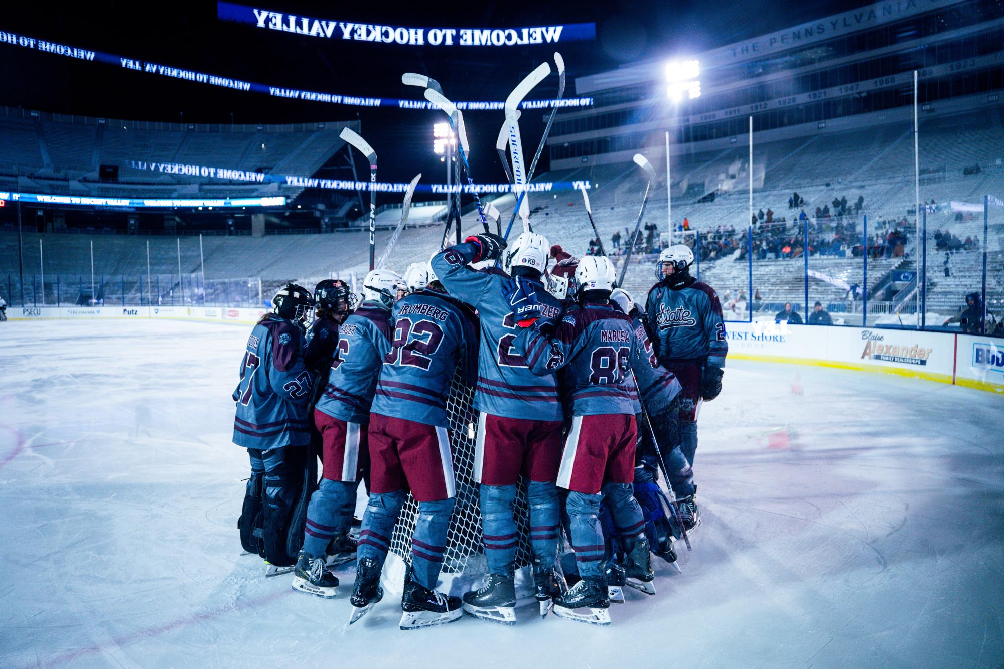 Prior to the game, State College gathers around its net to make final speeches and mental preparations. With the massive stadium looming around them and the anticipation reaching a boiling point, the team readied themselves for their rivals. 