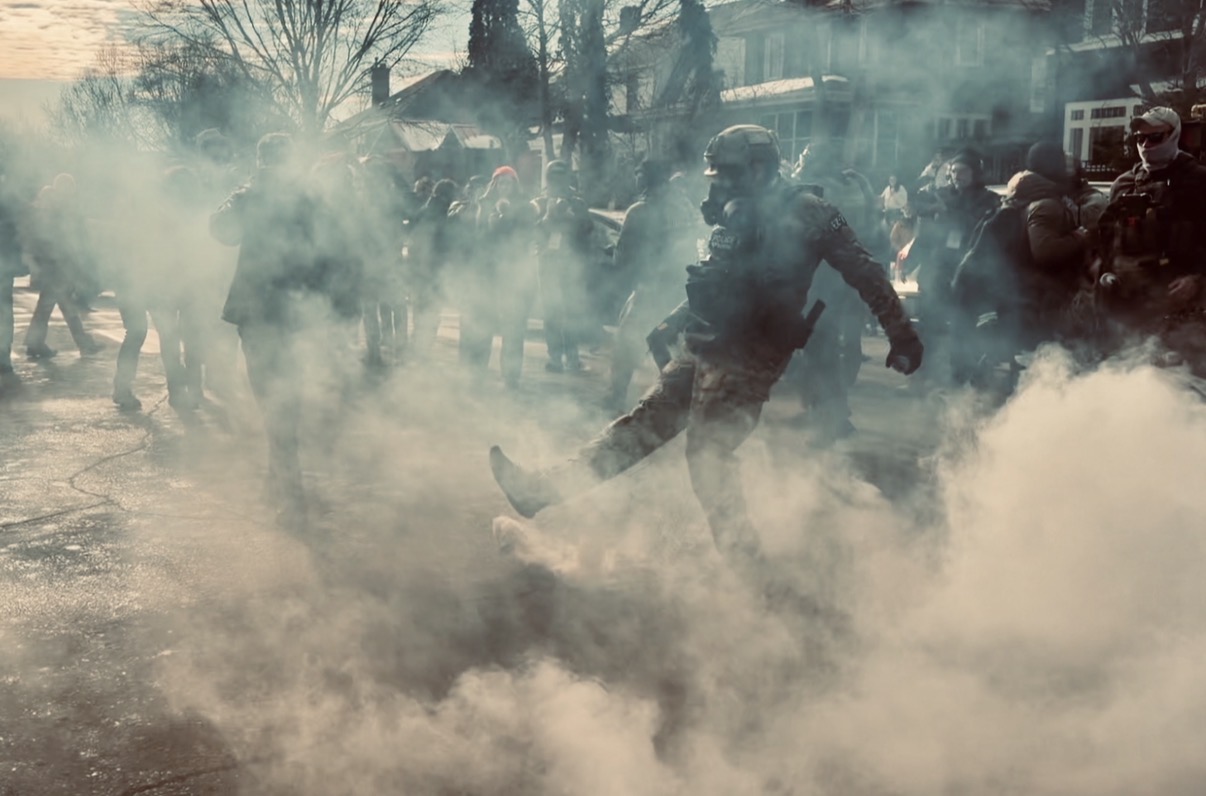 ICE officer deploys tear gas during opposition from Minneapolis residents on Jan. 12. Photo courtesy of Ben and Sam Luhmann 
