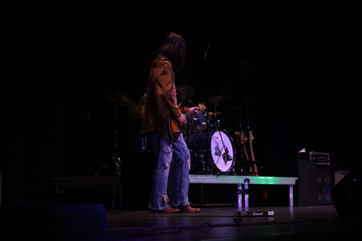 Electric guitarist Evan Zorn performing at the evening concert.