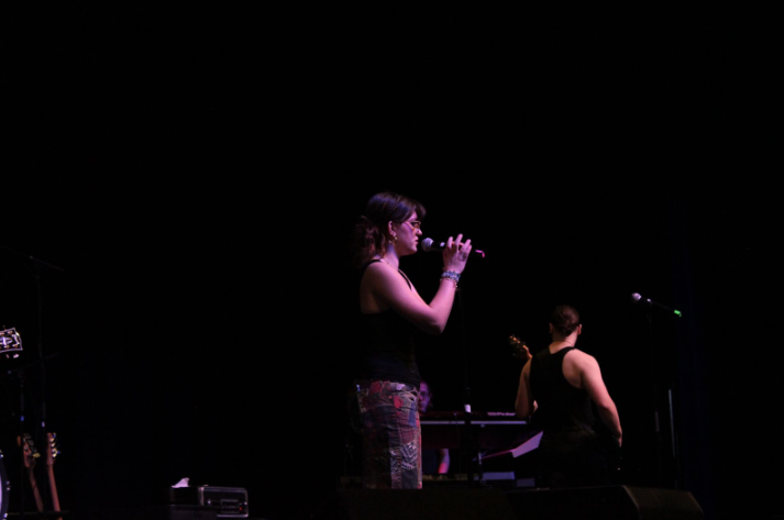 Vocalist Audrey Kelso performing on stage with guitar accompaniment from James Lukehart.