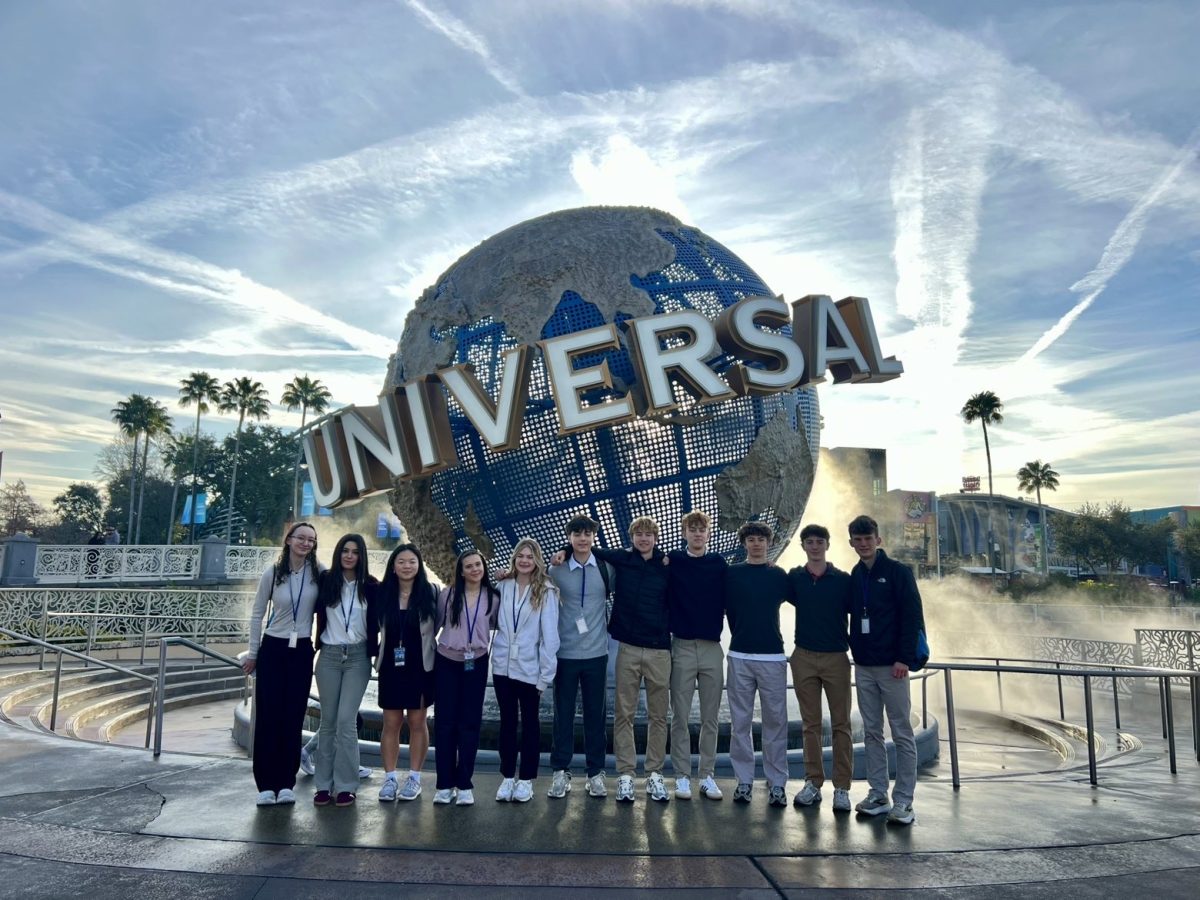 DECA students smile in front of the iconic globe at Universal Studios Orlando. Photo courtesy of Nathan Simpson.