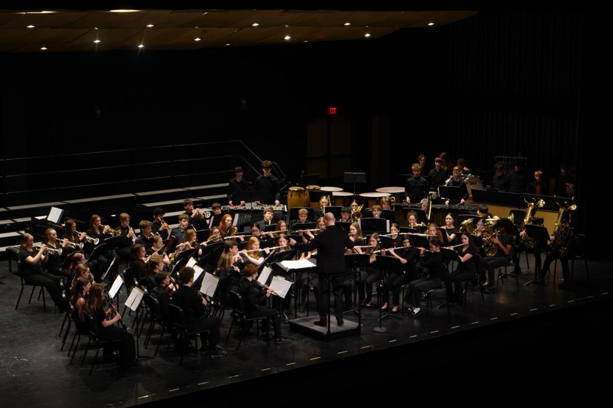 Band director, Paul Leskowicz, conducts the ninth-grade band as they perform a piece from Aaron Copland’s “Old American Songs."