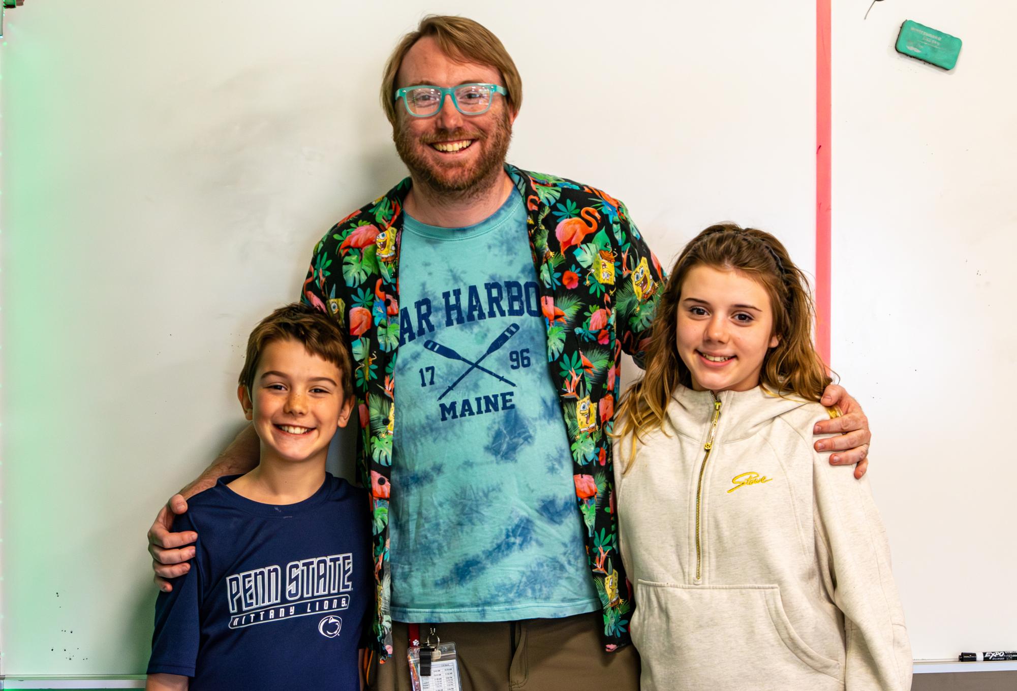 Jared McConkey poses with his two children on Take Your Kid to Work Day on Monday, April 13. 