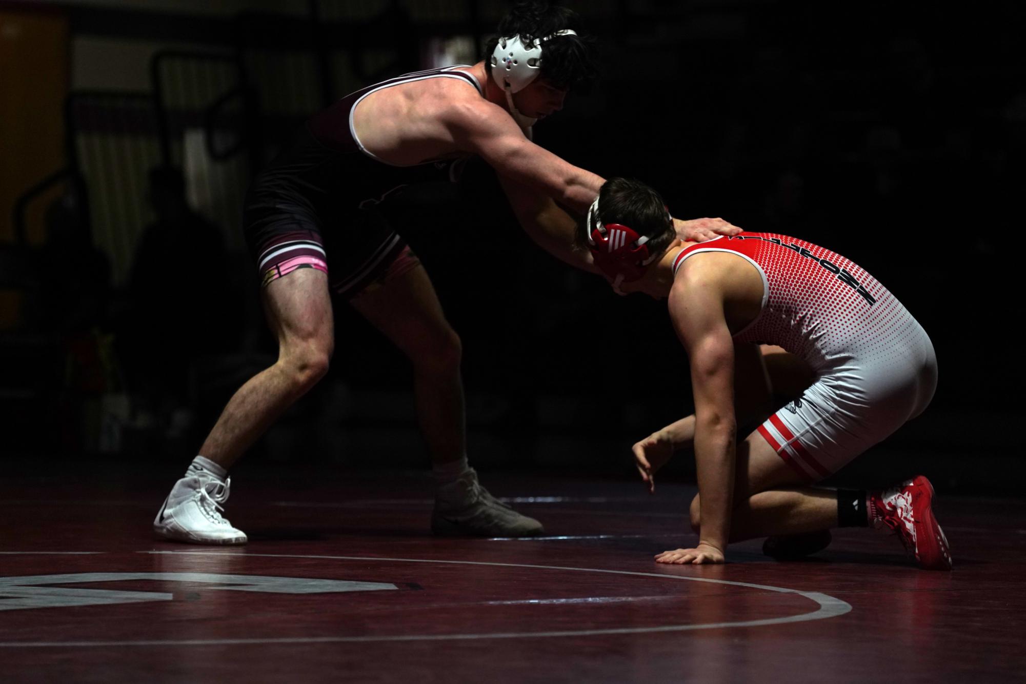 Junior James Whitbred punishes an opponent in the team's match against Williamsport.