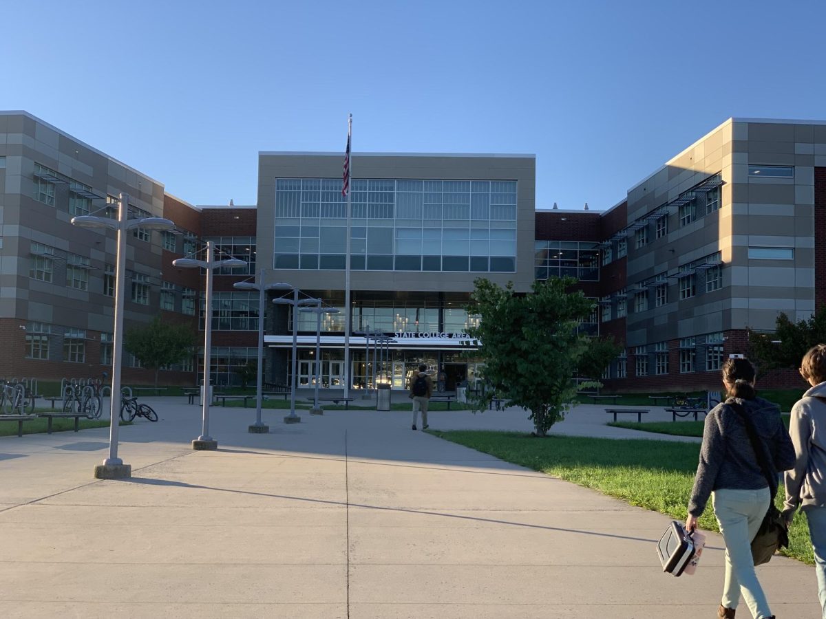 Two students walk towards State High's lower entrance before school.