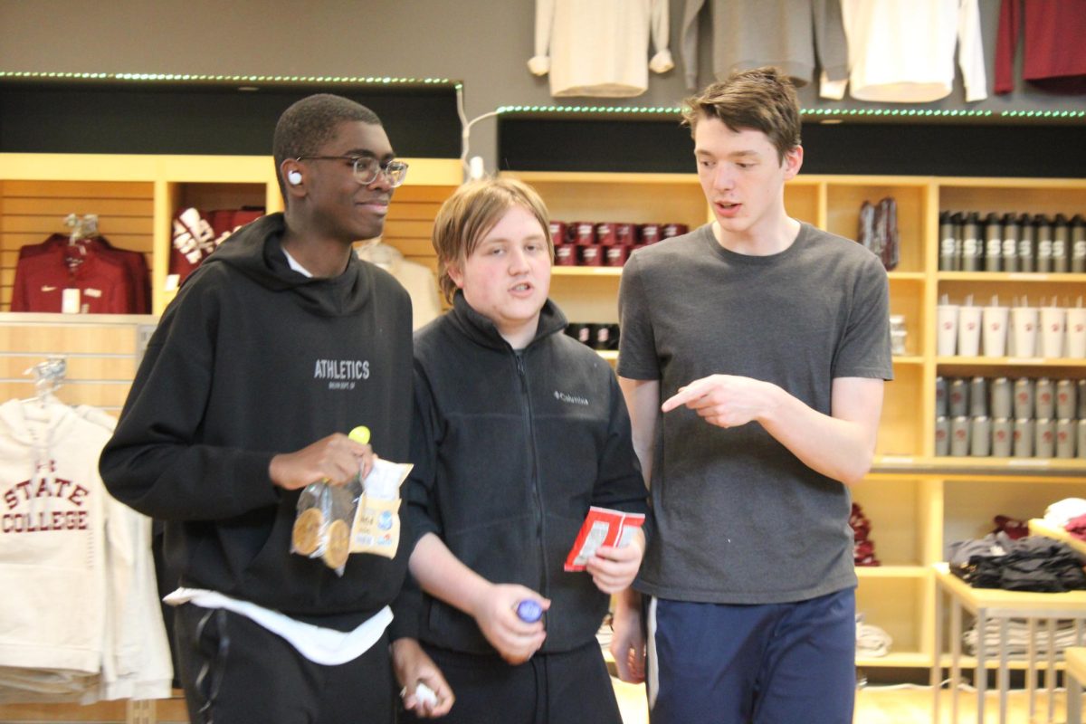 State High students leave the Roar Store carrying snacks and drinks. 
